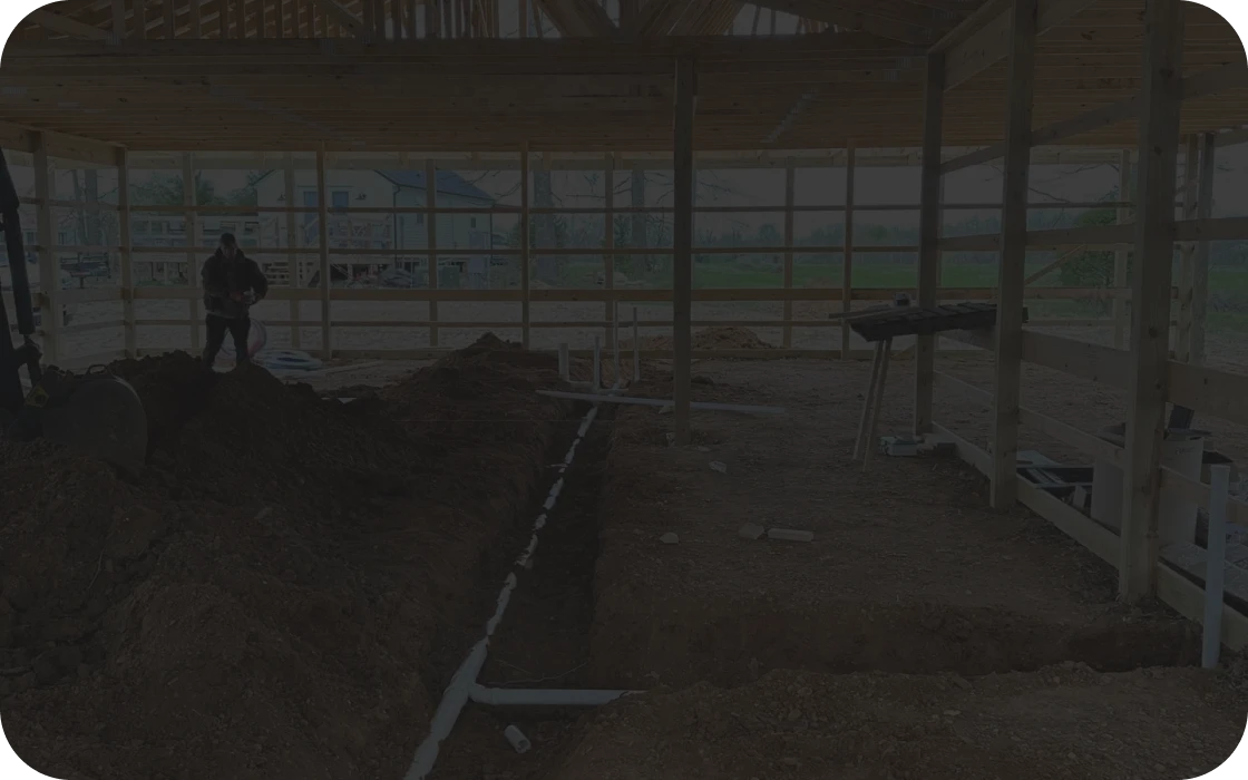 Building construction site with excavated area.